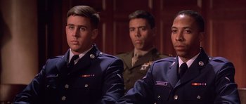 Movie still from “A Few Good Men” (1992), directed by Rob Reiner – A group of men in military uniforms standing next to each other; Close Up shot, Low angle