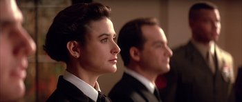 Movie still from “A Few Good Men” (1992), directed by Rob Reiner – A man and a woman wearing suits and ties; Close Up shot, Low angle