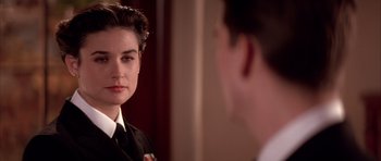 Movie still from “A Few Good Men” (1992), directed by Rob Reiner – A young man looking into a mirror while a young woman looks at him; Close Up shot, Over the shoulder angle