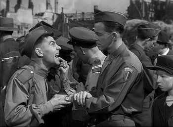 Movie still from “A Foreign Affair” (1948), directed by Billy Wilder – A group of men standing next to each other; Medium shot, Low angle