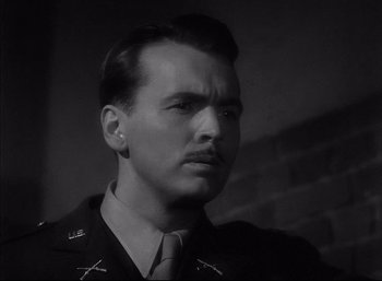 Movie still from “A Foreign Affair” (1948), directed by Billy Wilder – A man with a mustache wearing a military uniform; Close Up shot, Low angle