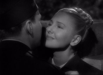 Movie still from “A Foreign Affair” (1948), directed by Billy Wilder – A man and a woman kissing each other; Close Up shot, Over the shoulder angle