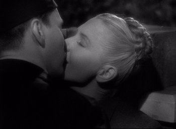 Movie still from “A Foreign Affair” (1948), directed by Billy Wilder – A man and a woman kissing each other; Close Up shot, High angle