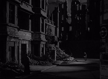 Movie still from “A Foreign Affair” (1948), directed by Billy Wilder – A black and white photo of a city street; Extreme Wide shot, High angle