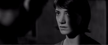 Movie still from “A Girl Walks Home Alone at Night” (2014), directed by Ana Lily Amirpour – A black - and - white photo of a woman's face; Close Up shot, Over the shoulder angle