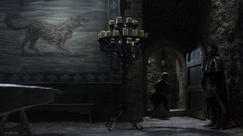 Movie still from “Game of Thrones” (2011), created by D.B. Weiss – Many candles in a large candle holder; Wide shot, Low angle