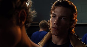 Movie still from “A History of Violence” (2005), directed by David Cronenberg – A young man is getting his hair brushed; Close Up shot, Over the shoulder angle