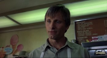 Movie still from “A History of Violence” (2005), directed by David Cronenberg – A person wearing an apron; Close Up shot, Low angle