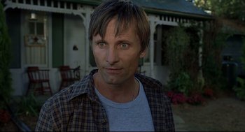 Movie still from “A History of Violence” (2005), directed by David Cronenberg – A person wearing a plaid shirt; Close Up shot, Low angle