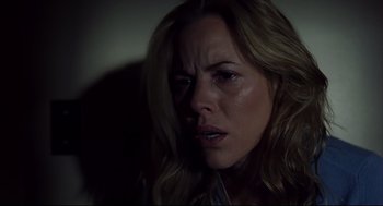 Movie still from “A History of Violence” (2005), directed by David Cronenberg – A person with long blonde hair; Close Up shot, Low angle