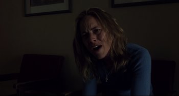 Movie still from “A History of Violence” (2005), directed by David Cronenberg – A woman with her mouth wide open in a dark room; Close Up shot, Over the shoulder angle