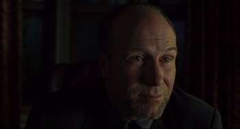 Movie still from “A History of Violence” (2005), directed by David Cronenberg – A person wearing a suit and tie; Close Up shot, Over the shoulder angle