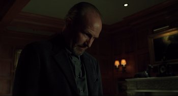 Movie still from “A History of Violence” (2005), directed by David Cronenberg – A man in a suit and tie looking down; Close Up shot, Low angle