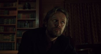 Movie still from “A History of Violence” (2005), directed by David Cronenberg – A person wearing a suit and tie; Close Up shot, Low angle