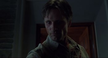 Movie still from “A History of Violence” (2005), directed by David Cronenberg – A person wearing a shirt with blood all over his face; Close Up shot, Low angle
