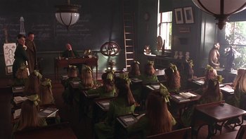 Movie still from “A Little Princess” (1995), directed by Alfonso Cuarón – A class room full of students wearing green bows; Wide shot, High angle