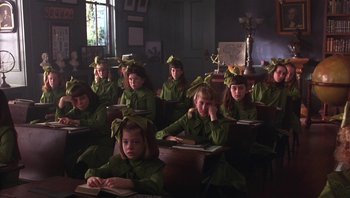 Movie still from “A Little Princess” (1995), directed by Alfonso Cuarón – A group of young girls sitting at desks in a class room; Medium shot, High angle