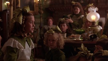 Movie still from “A Little Princess” (1995), directed by Alfonso Cuarón – A group of children sitting around a table; Medium shot, Over the shoulder angle