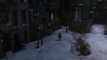Movie still from “A Little Princess” (1995), directed by Alfonso Cuarón – A person is walking in the snow at night; Extreme Wide shot, High angle