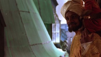 Movie still from “A Little Princess” (1995), directed by Alfonso Cuarón – A man with a beard wearing a turban; Close Up shot, Low angle