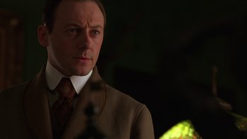 Movie still from “A Little Princess” (1995), directed by Alfonso Cuarón – A person wearing a suit and tie; Close Up shot, Low angle