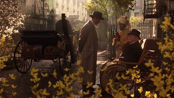 Movie still from “A Little Princess” (1995), directed by Alfonso Cuarón – A group of men standing on a sidewalk near a horse drawn carriage; Wide shot, Over the shoulder angle