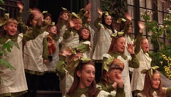 Movie still from “A Little Princess” (1995), directed by Alfonso Cuarón – A group of young girls wearing green and white costumes; Medium shot, High angle