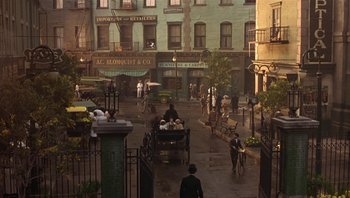Movie still from “A Little Princess” (1995), directed by Alfonso Cuarón – A street scene with a horse and carriage and people; Extreme Wide shot, High angle