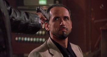 Movie still from “A Low Down Dirty Shame” (1994), directed by Keenen Ivory Wayans – A man is holding a gun up to his head; Close Up shot, Low angle
