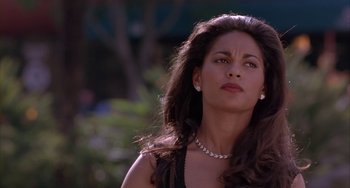 Movie still from “A Low Down Dirty Shame” (1994), directed by Keenen Ivory Wayans – A beautiful woman with long hair wearing a necklace; Close Up shot, Low angle