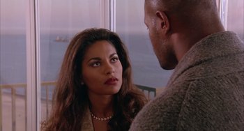 Movie still from “A Low Down Dirty Shame” (1994), directed by Keenen Ivory Wayans – A man and a woman looking at one another; Close Up shot, Over the shoulder angle