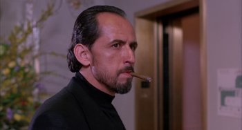 Movie still from “A Low Down Dirty Shame” (1994), directed by Keenen Ivory Wayans – A person with a cigar in his mouth; Close Up shot, Low angle