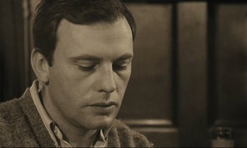 Movie still from “A Man and a Woman” (1966), directed by Claude Lelouch – A person with his eyes closed; Close Up shot, High angle