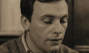 Movie still from “A Man and a Woman” (1966), directed by Claude Lelouch – A person with his eyes closed; Close Up shot, High angle