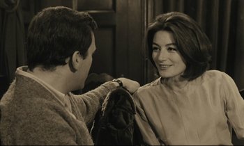 Movie still from “A Man and a Woman” (1966), directed by Claude Lelouch – A man and a woman looking at each other; Close Up shot, Over the shoulder angle