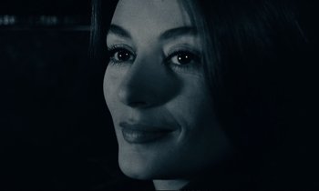 Movie still from “A Man and a Woman” (1966), directed by Claude Lelouch – A woman's face in black and white; Close Up shot, Over the shoulder angle