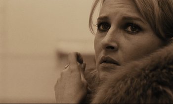 Movie still from “A Man and a Woman” (1966), directed by Claude Lelouch – A person wearing a fur coat; Close Up shot, Over the shoulder angle