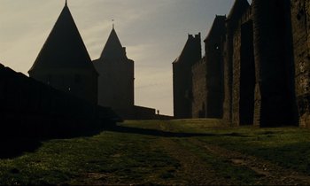 Movie still from “A Man and a Woman” (1966), directed by Claude Lelouch – A couple of buildings that are next to each other; Extreme Wide shot, Low angle