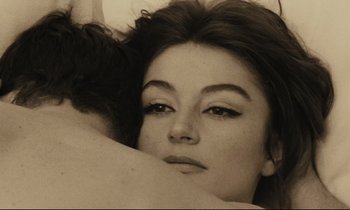 Movie still from “A Man and a Woman” (1966), directed by Claude Lelouch – A person laying on a bed; Close Up shot, Overhead angle