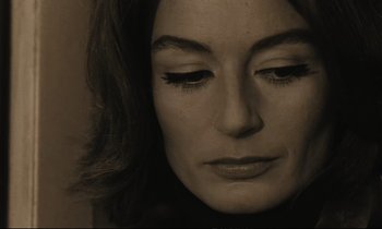 Movie still from “A Man and a Woman” (1966), directed by Claude Lelouch – A woman's face in black and white; Close Up shot, High angle