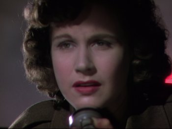 Movie still from “A Matter of Life and Death” (1946), directed by Emeric Pressburger – A person holding a microphone; Close Up shot, Low angle
