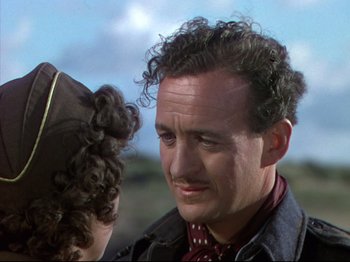 Movie still from “A Matter of Life and Death” (1946), directed by Emeric Pressburger – A person with curly hair; Close Up shot, Over the shoulder angle