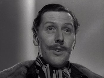 Movie still from “A Matter of Life and Death” (1946), directed by Emeric Pressburger – A person with a mustache; Close Up shot, Low angle