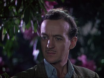 Movie still from “A Matter of Life and Death” (1946), directed by Emeric Pressburger – A person wearing a suit and tie; Close Up shot, Low angle