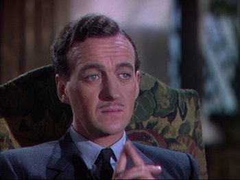 Movie still from “A Matter of Life and Death” (1946), directed by Emeric Pressburger – A person wearing a suit and tie; Close Up shot, High angle