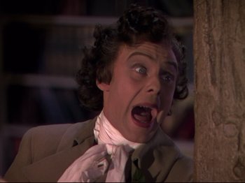 Movie still from “A Matter of Life and Death” (1946), directed by Emeric Pressburger – A person wearing a suit and tie; Close Up shot, Low angle