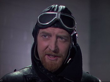 Movie still from “A Matter of Life and Death” (1946), directed by Emeric Pressburger – A person wearing a helmet and goggles; Close Up shot, Low angle