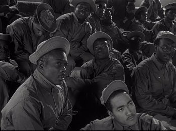 Movie still from “A Matter of Life and Death” (1946), directed by Emeric Pressburger – A black and white photo of a group of men in military uniforms; Medium shot, High angle