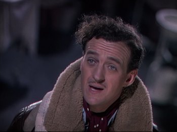 Movie still from “A Matter of Life and Death” (1946), directed by Emeric Pressburger – A person wearing a jacket; Close Up shot, High angle