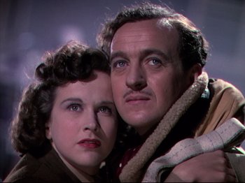 Movie still from “A Matter of Life and Death” (1946), directed by Emeric Pressburger – A man and a woman standing next to each other; Close Up shot, Low angle